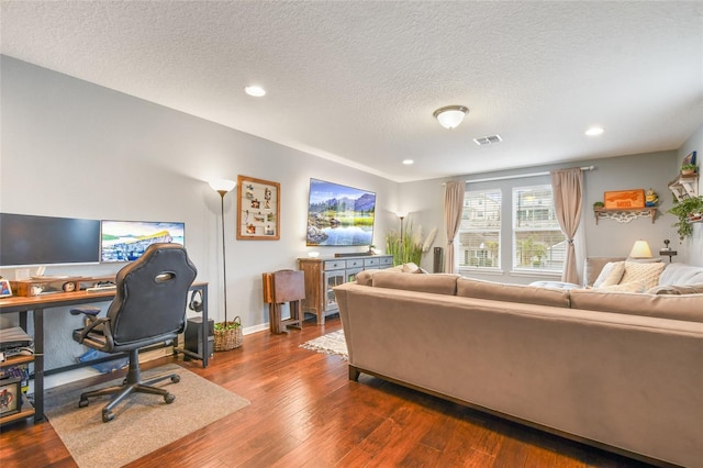 1416 Cabot Dr, Clermont, FL 34711 - living area featuring dark wood-style floors, visible vents, a textured ceiling, and recessed lighting