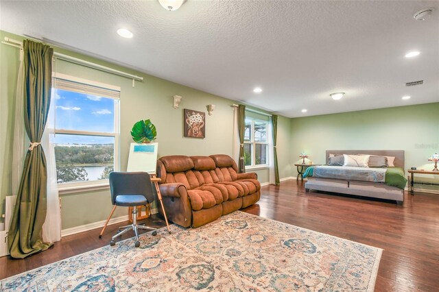1416 Cabot Dr, Clermont, FL 34711 - living area featuring wood finished floors, visible vents, and plenty of natural light