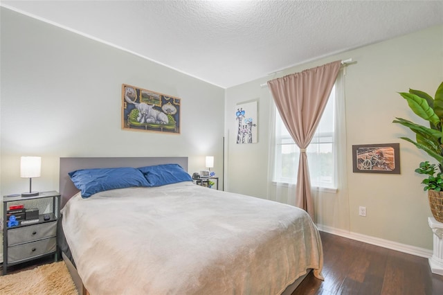 1416 Cabot Dr, Clermont, FL 34711 - bedroom with baseboards, hardwood / wood-style flooring, and a textured ceiling