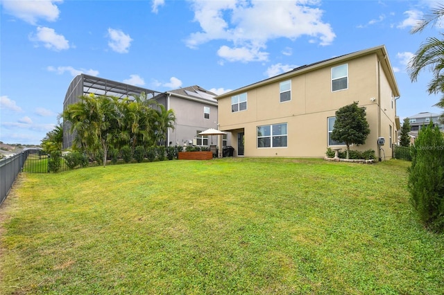 1416 Cabot Dr, Clermont, FL 34711 - rear view of house with a lawn, stucco siding, and a fenced backyard