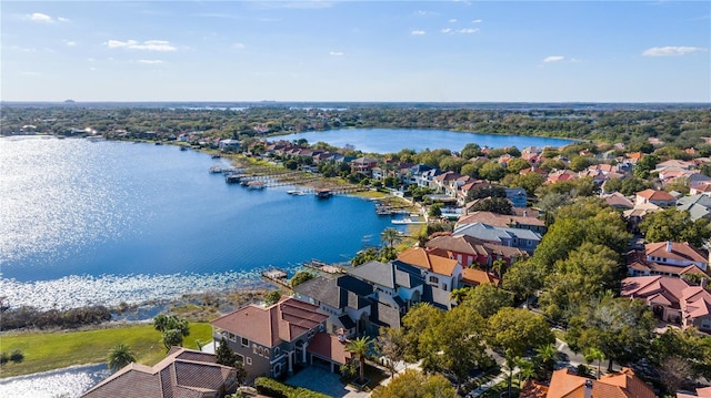 birds eye view of property with a water view