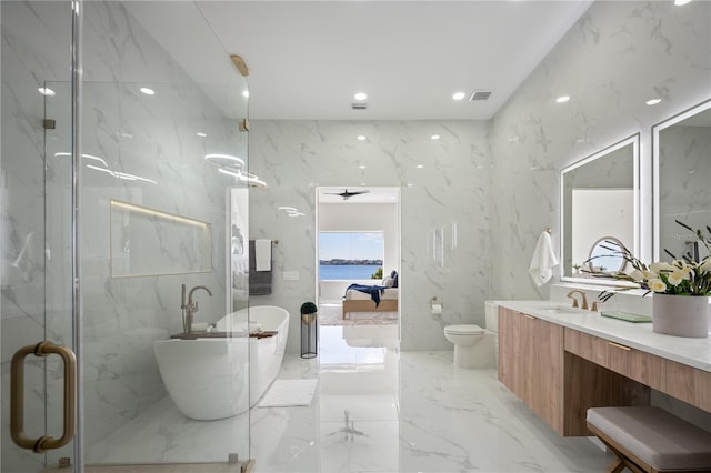 full bathroom with vanity, plus walk in shower, toilet, and a water view