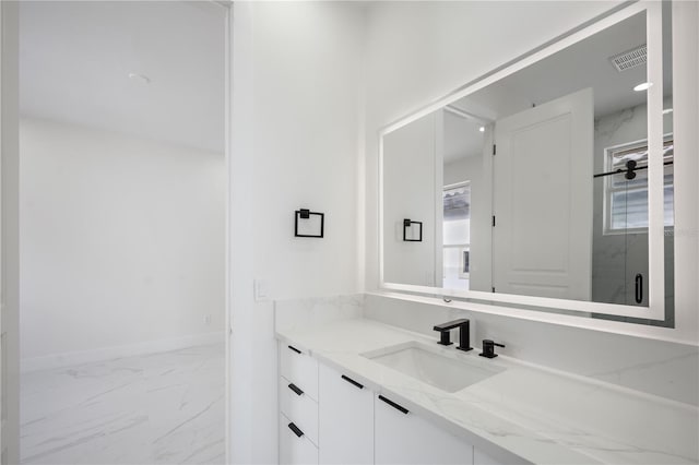 bathroom featuring vanity and a healthy amount of sunlight