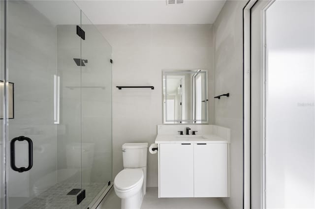 bathroom with vanity, toilet, and walk in shower