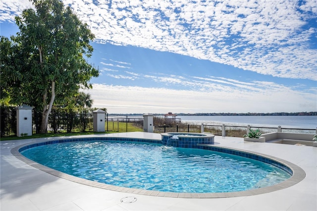 view of pool with a water view, an in ground hot tub, and central AC