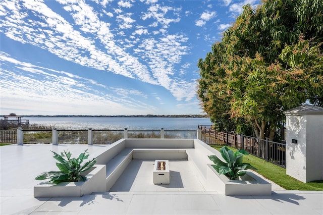 view of patio with a water view