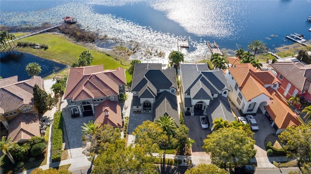 birds eye view of property with a water view