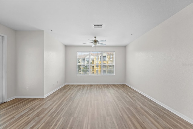 unfurnished room featuring light hardwood / wood-style floors and ceiling fan