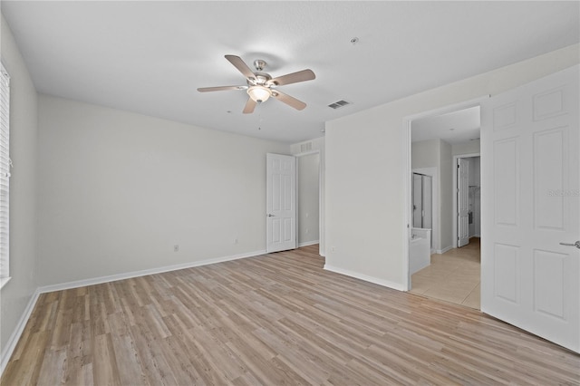 unfurnished room with ceiling fan and light hardwood / wood-style flooring