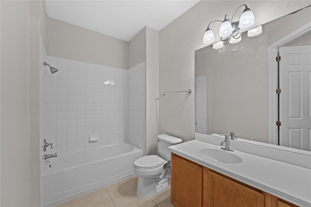 full bathroom with vanity, tiled shower / bath combo, tile patterned floors, and toilet