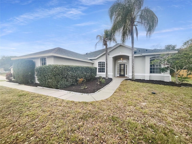 single story home featuring a front yard