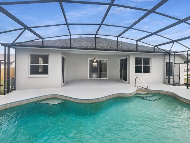 view of pool with a lanai, ceiling fan, and a patio area