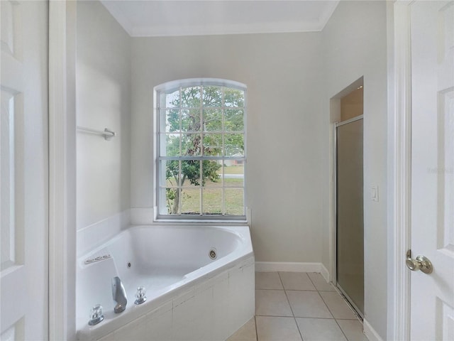 bathroom featuring plenty of natural light, tile patterned floors, and plus walk in shower