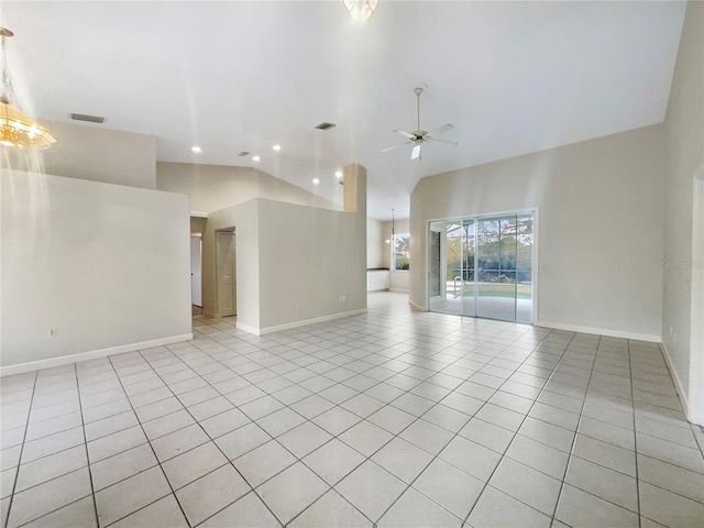 tiled spare room featuring ceiling fan and high vaulted ceiling