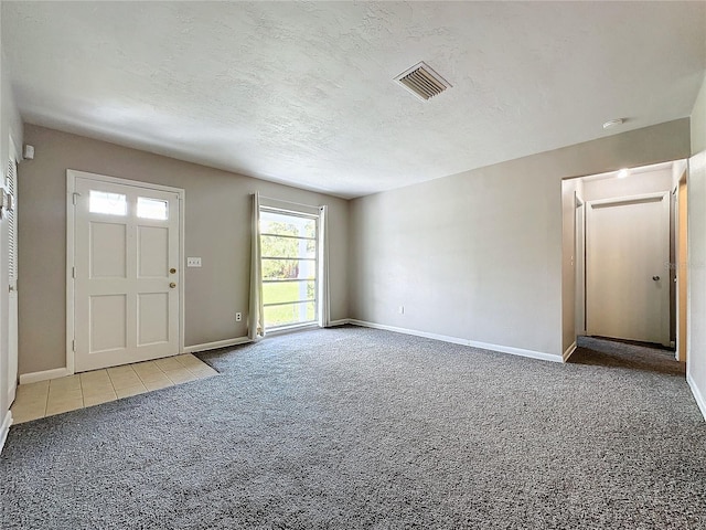 entrance foyer with light carpet