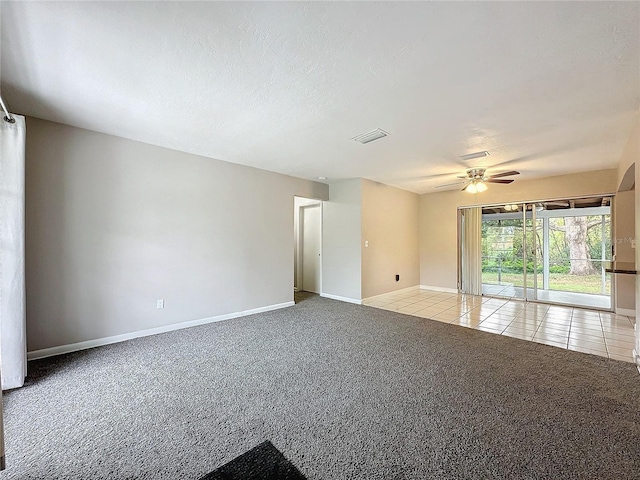 carpeted empty room featuring ceiling fan