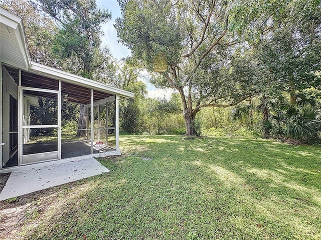 view of yard featuring a sunroom