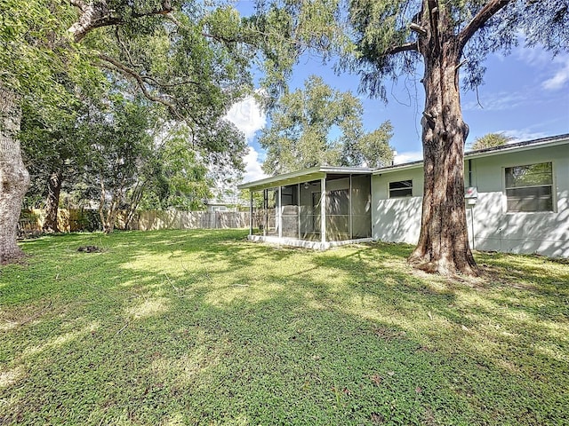 view of yard with a sunroom