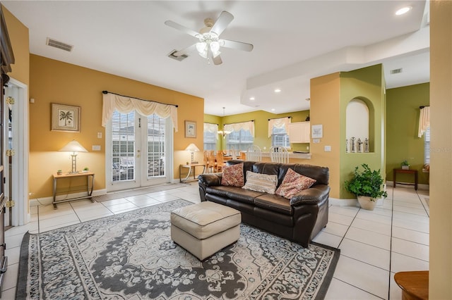 tiled living room featuring ceiling fan