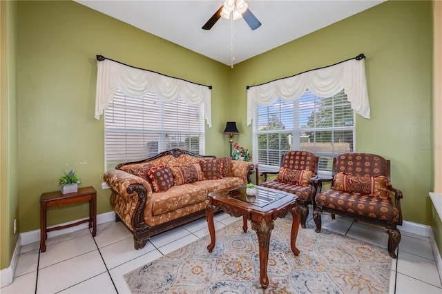 living room featuring ceiling fan and light tile patterned flooring