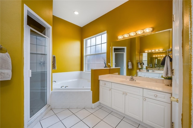 bathroom featuring separate shower and tub, vanity, and tile patterned floors