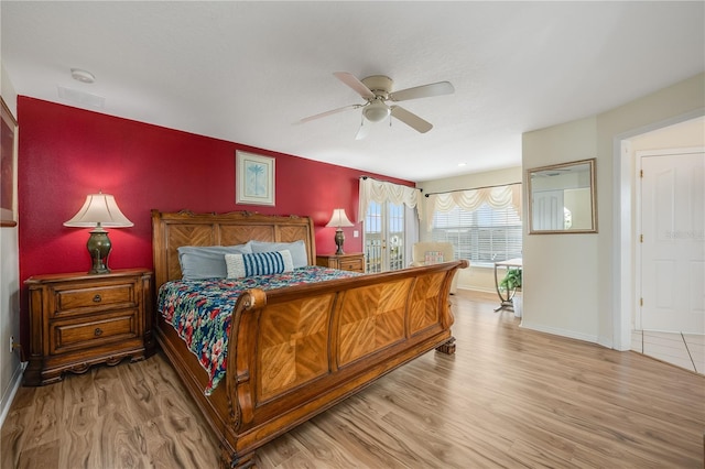 bedroom featuring ceiling fan and light wood-type flooring