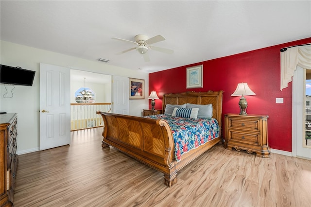 bedroom featuring ceiling fan and hardwood / wood-style flooring