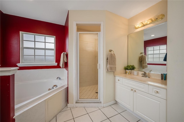 bathroom featuring plenty of natural light, tile patterned floors, vanity, and shower with separate bathtub