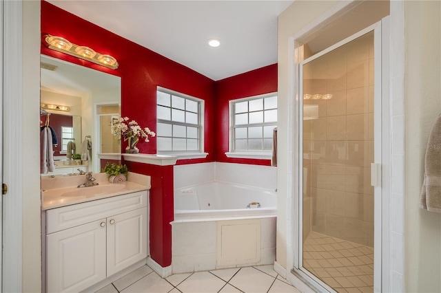 bathroom featuring separate shower and tub, vanity, and tile patterned flooring