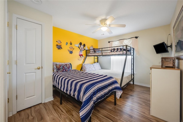 bedroom featuring ceiling fan and hardwood / wood-style floors