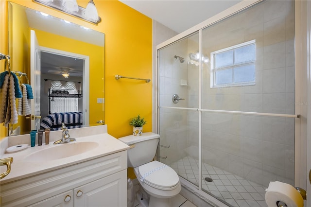 bathroom with a shower with shower door, toilet, and vanity