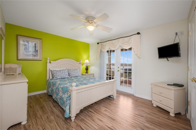 bedroom with ceiling fan, light hardwood / wood-style floors, and access to outside