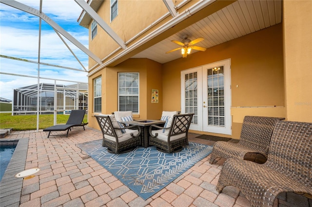 view of patio with a lanai and ceiling fan