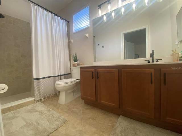 bathroom featuring curtained shower, toilet, vanity, and tile patterned flooring