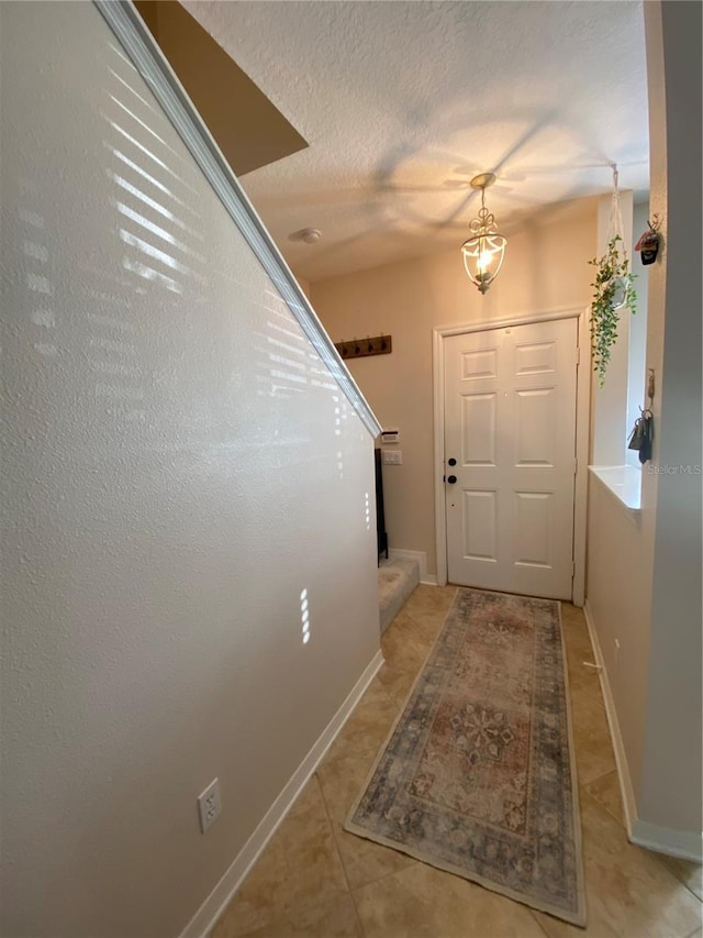 doorway featuring light tile patterned floors