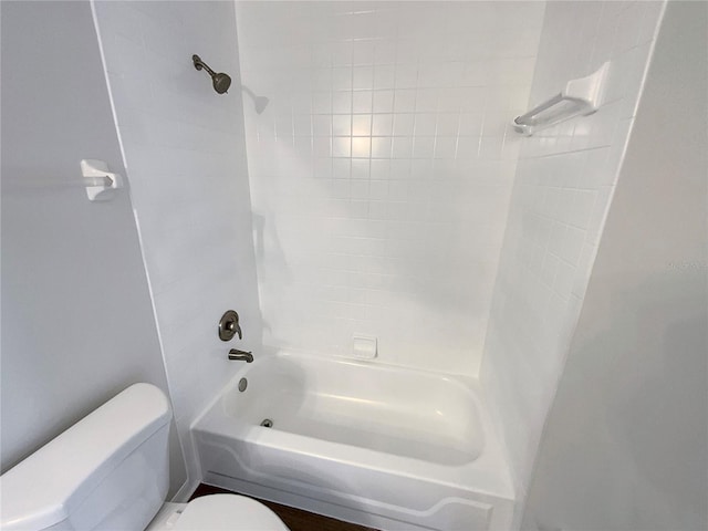 bathroom with toilet and shower / tub combination