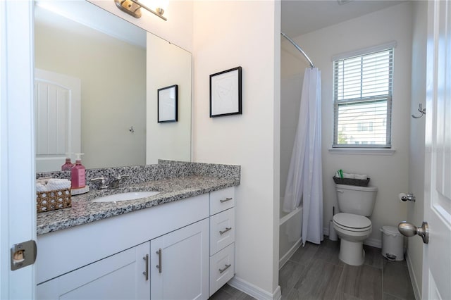 full bathroom featuring toilet, vanity, and shower / bath combo with shower curtain