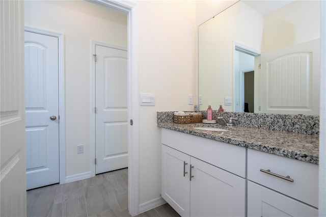 bathroom with vanity and wood-type flooring