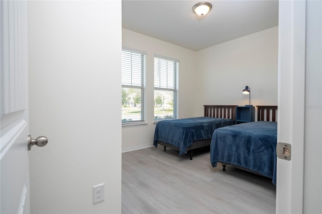 bedroom with light hardwood / wood-style floors