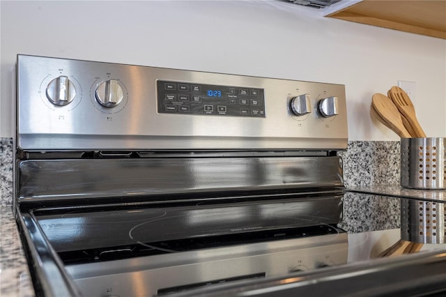 room details with electric stove and backsplash