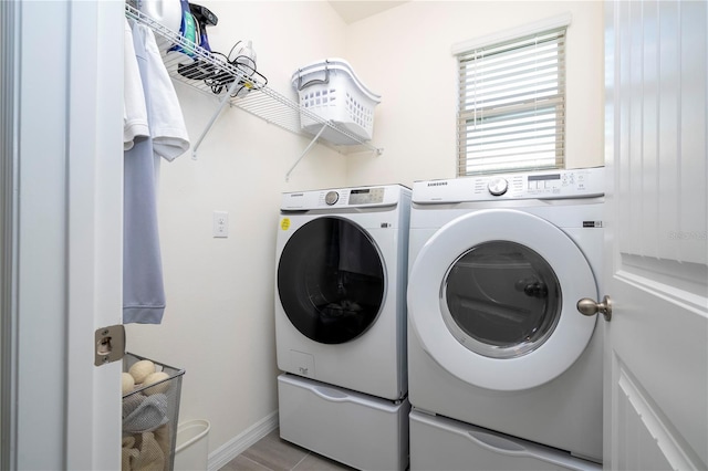 laundry room with washing machine and clothes dryer