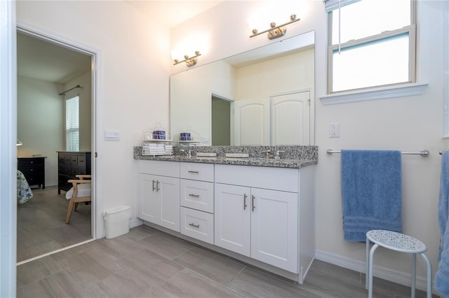 bathroom with vanity and a wealth of natural light