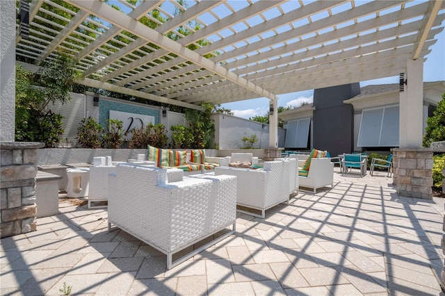 view of patio with a pergola and an outdoor living space