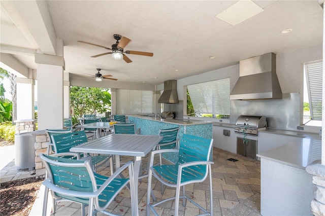 view of patio / terrace with an outdoor kitchen, ceiling fan, and area for grilling