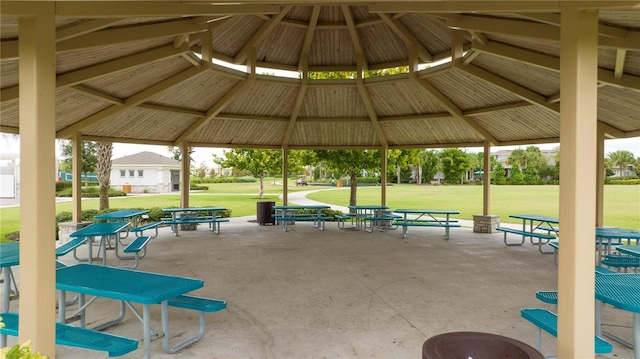 view of home's community with a lawn, a gazebo, and a patio area