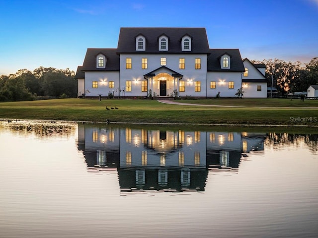 exterior space with a yard and a water view