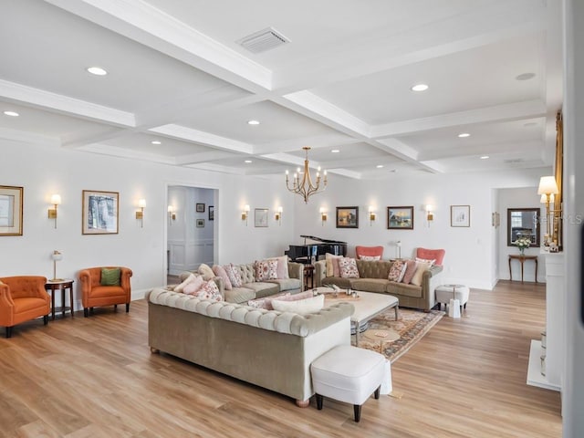 living room with beam ceiling, an inviting chandelier, coffered ceiling, and light hardwood / wood-style floors