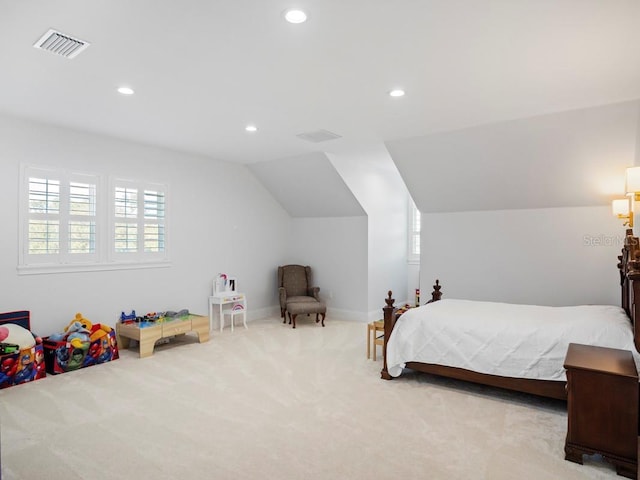 bedroom featuring lofted ceiling and light colored carpet