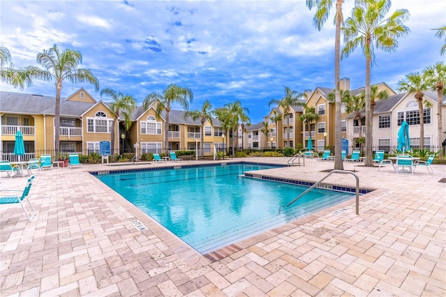 view of swimming pool with a patio