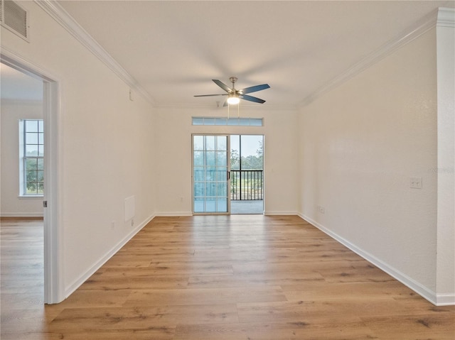 spare room featuring ceiling fan, crown molding, and light hardwood / wood-style flooring